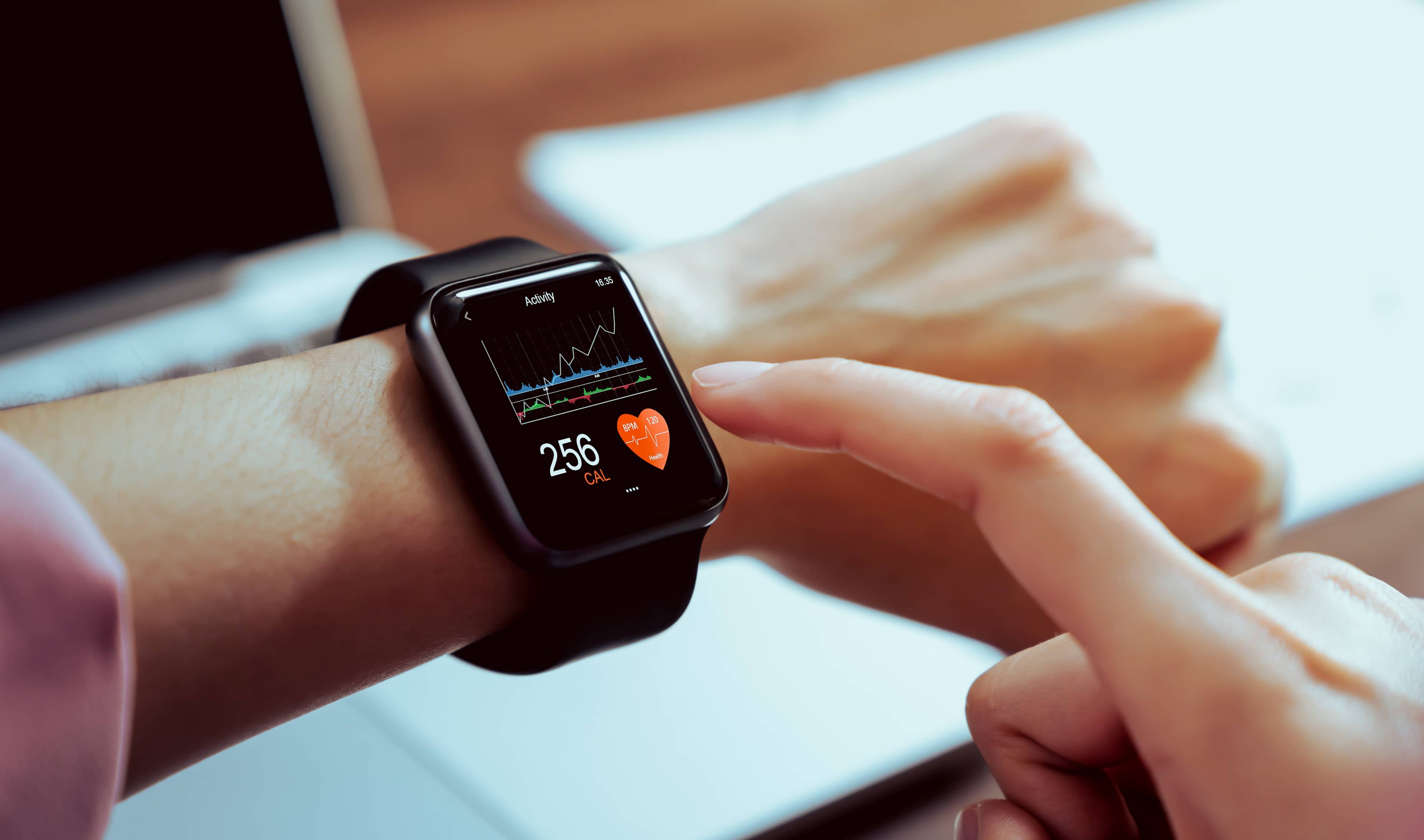 A smart watch showing heart rate