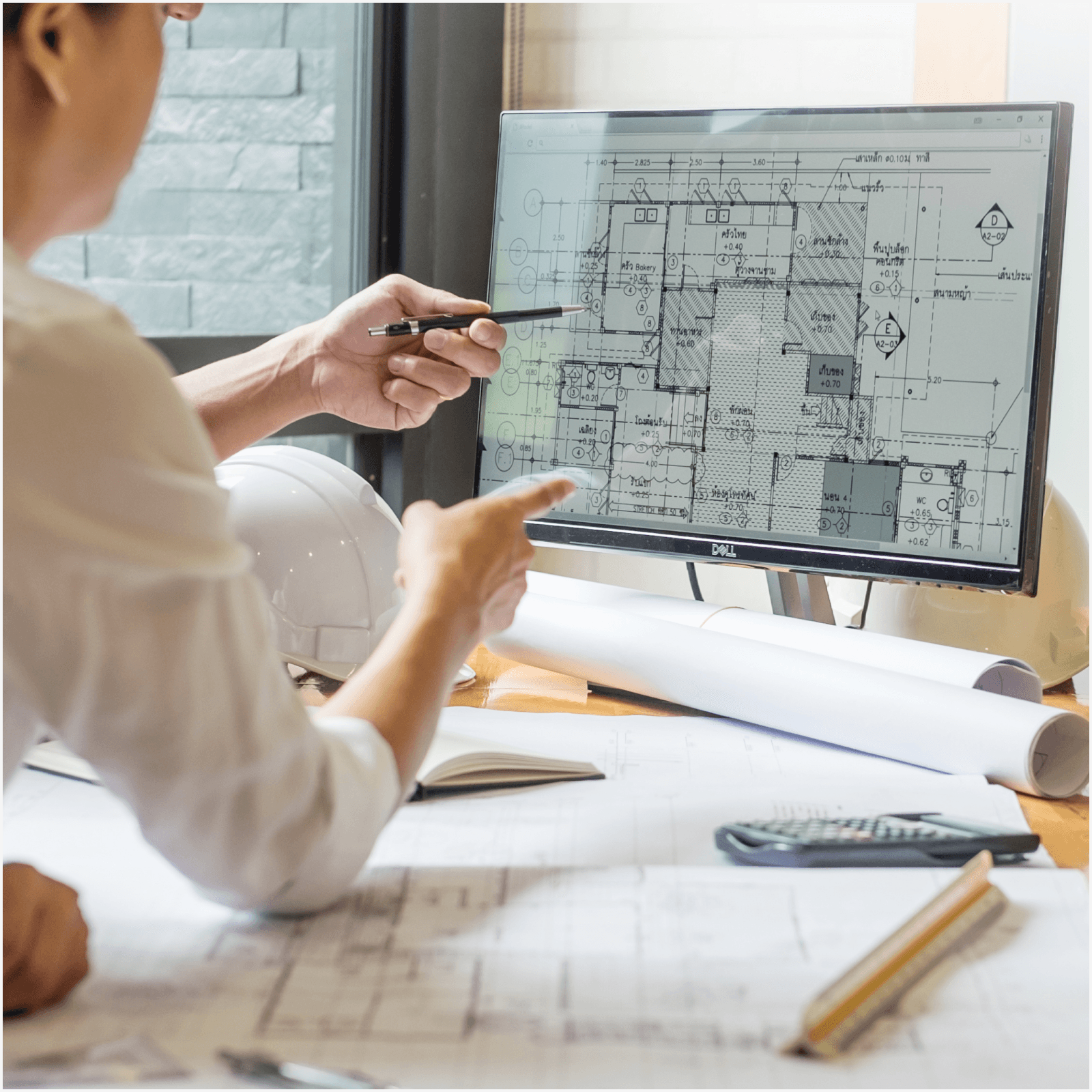 Person looking at cad drawings on a computer