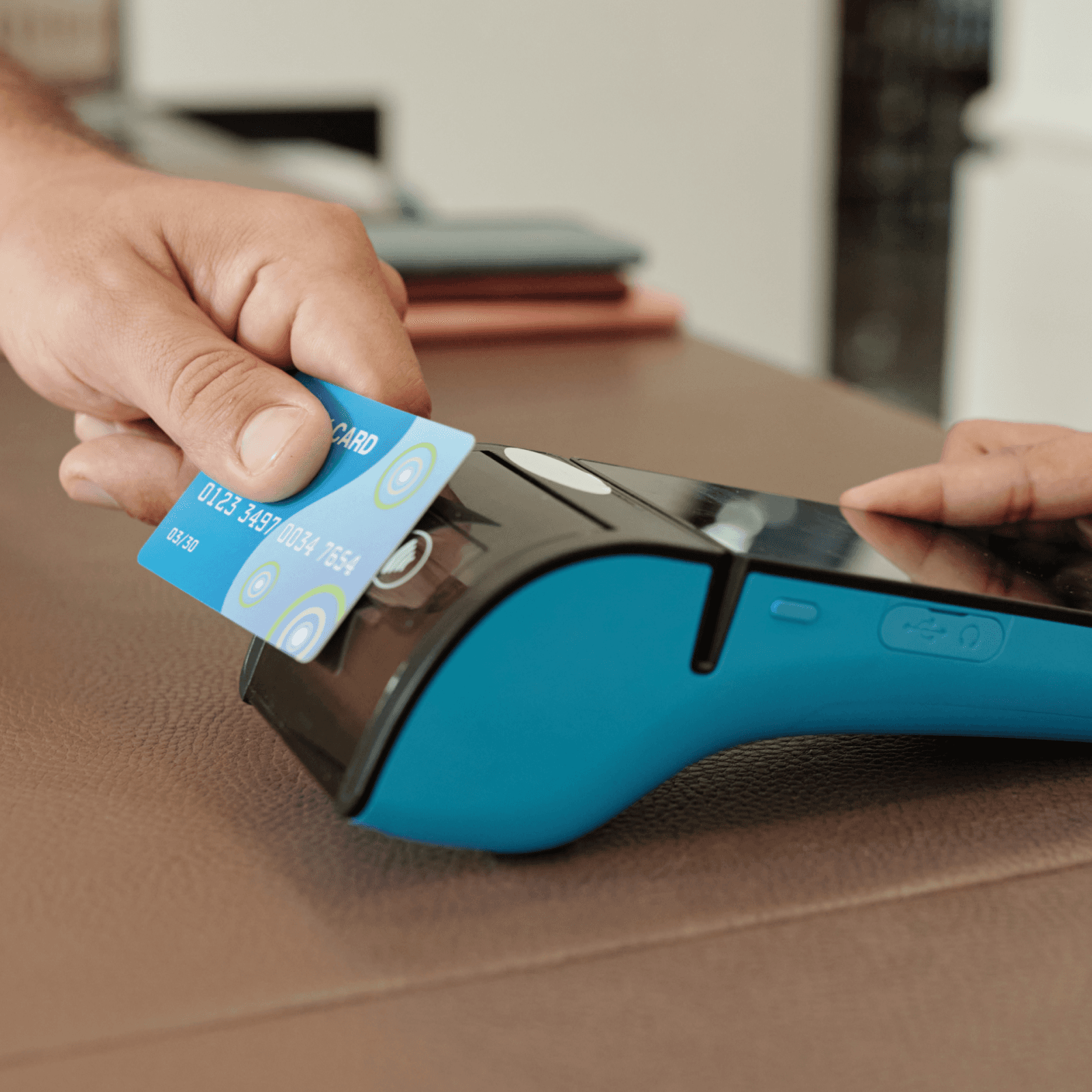 Person tapping card on card machine