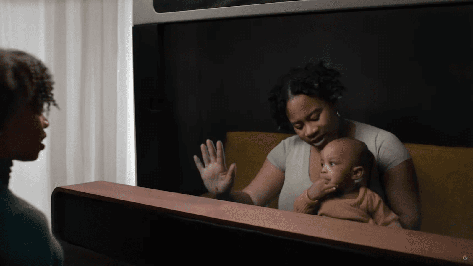 Woman and baby looking through a window